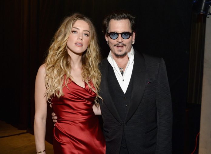 Amber Heard in 'a lot of pain' over ex-Johnny Depp lawsuit